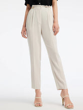 a woman in white pants